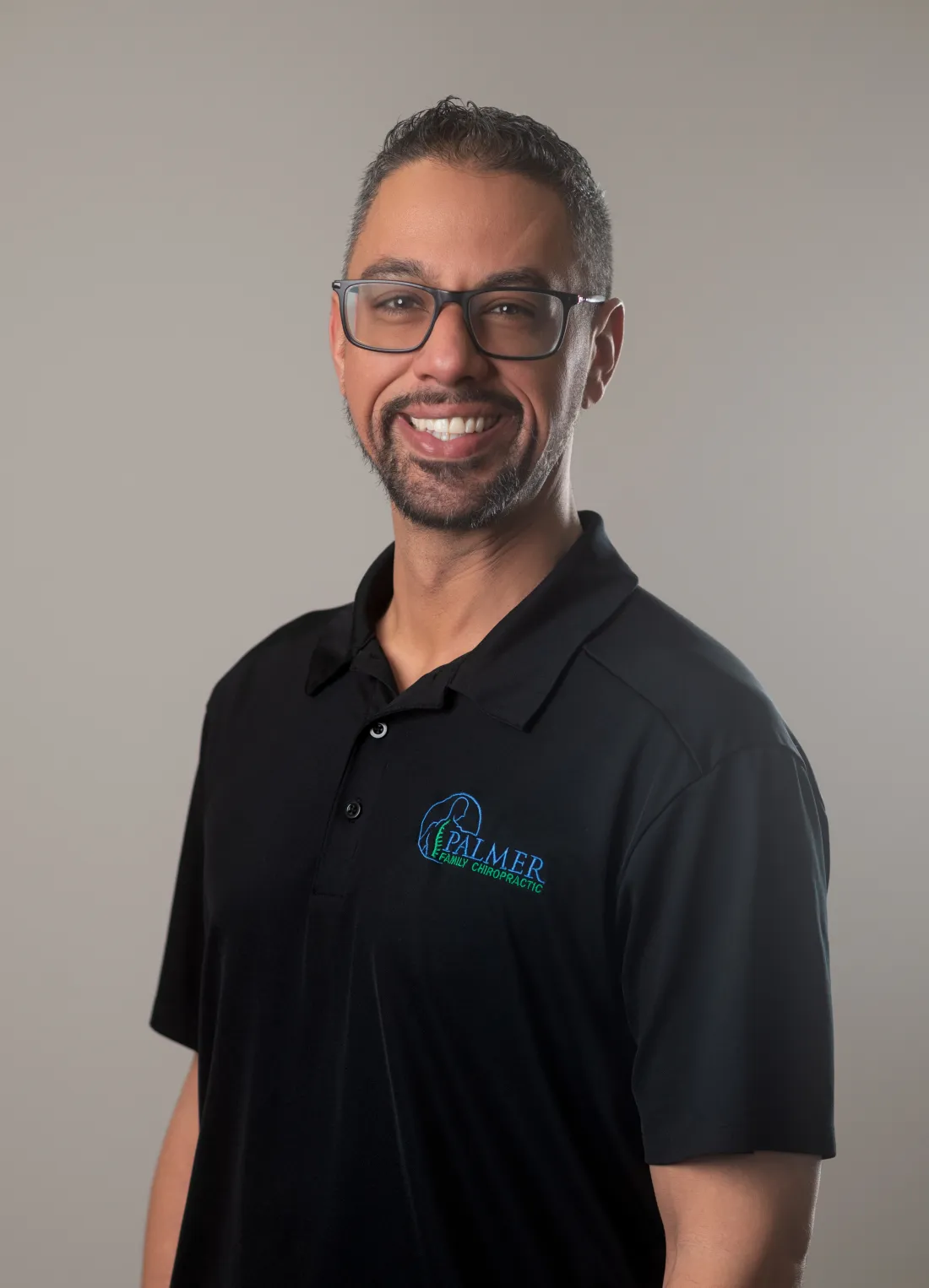 Portrait of Dr. James Palmer in clinical attire
