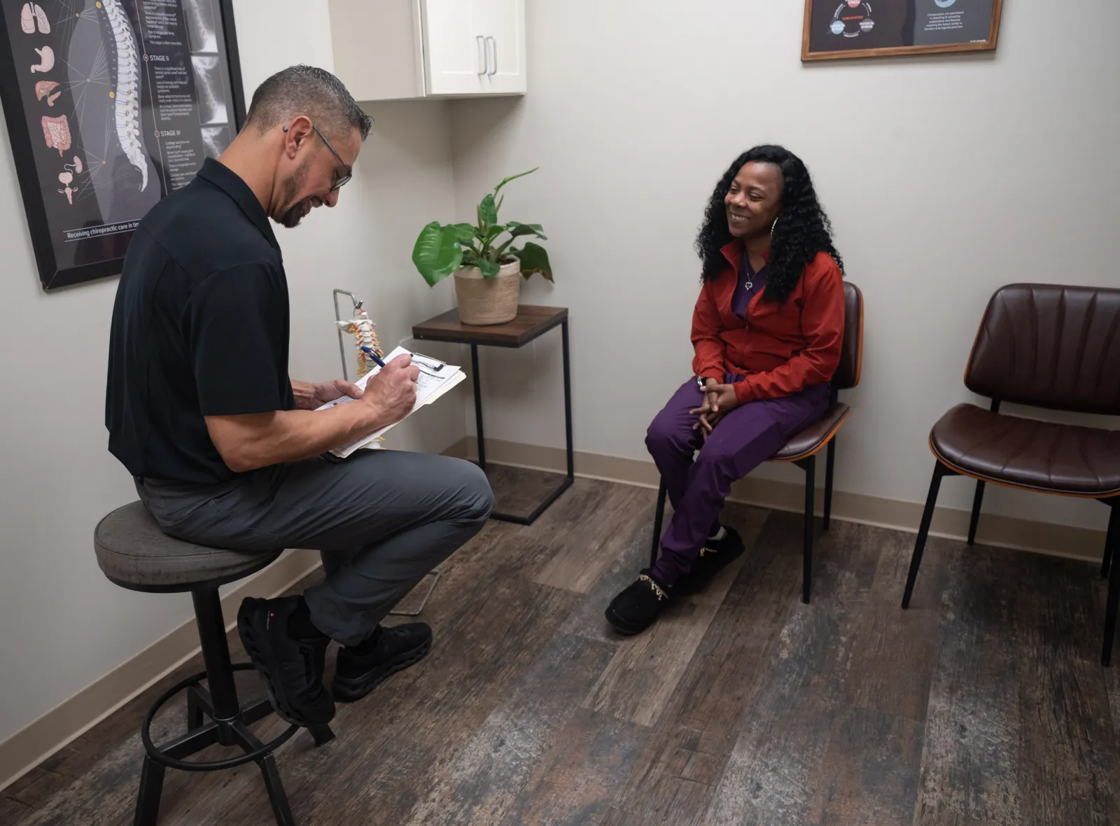 Dr. James Palmer speaking with a patient during a consultation