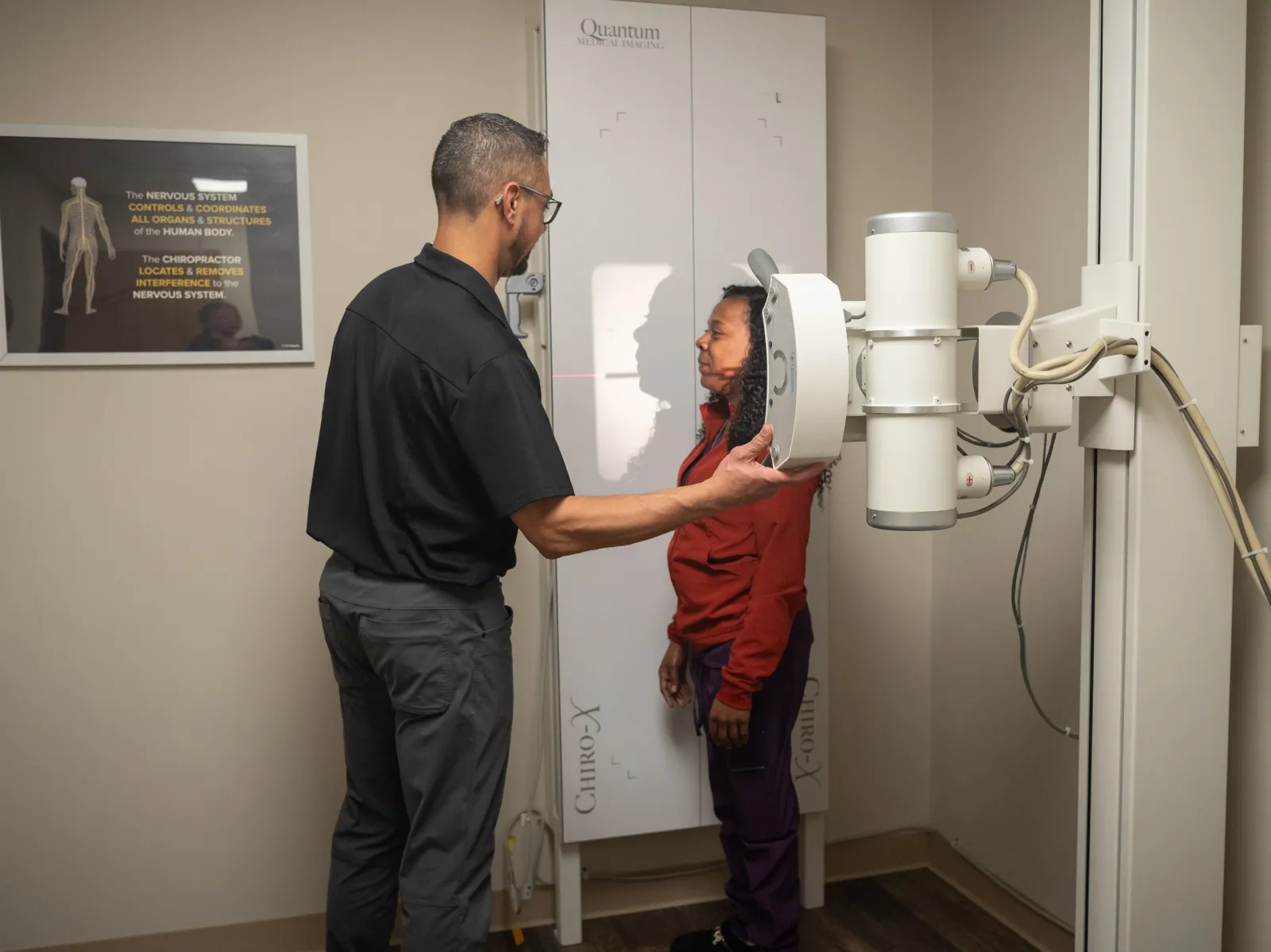 Dr. James Palmer positioning a patient for a standing spinal X-ray