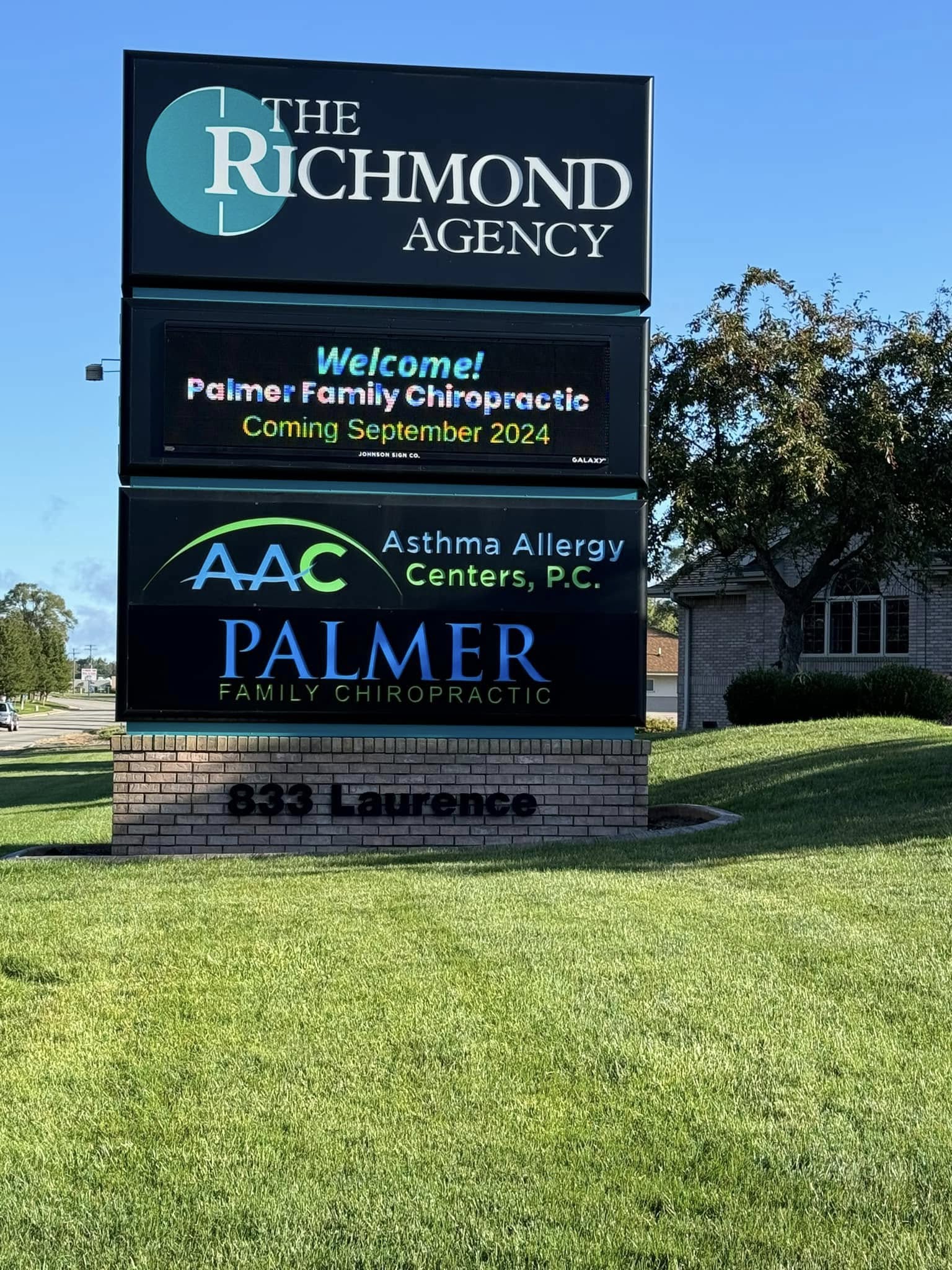 Roadside sign for Palmer Family Chiropractic at 833 Laurence Avenue